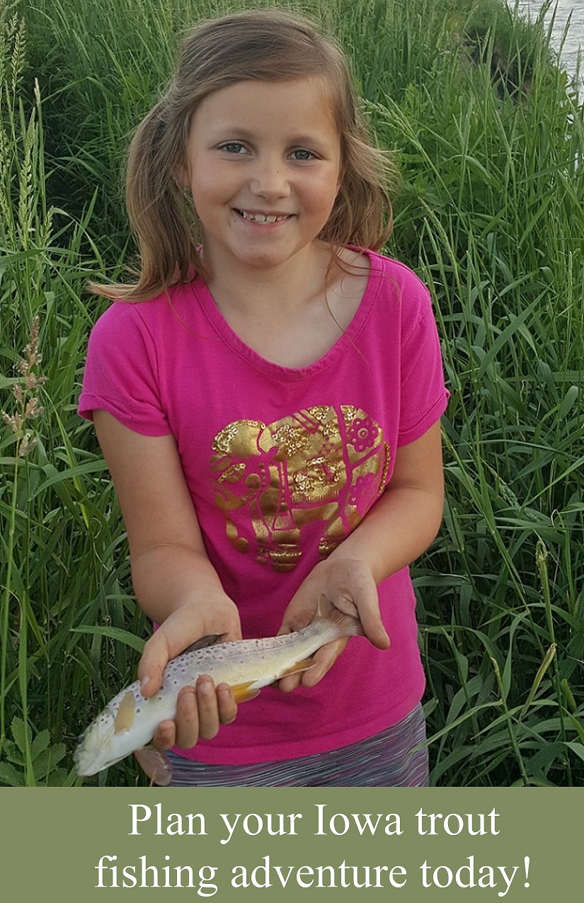 girl holding a trout caught at the kids trout fishing pond at the Bellevue Station